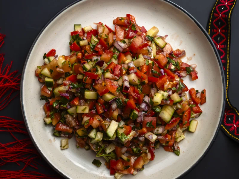 Shepherd's Salad with tomatoes, cucumber, peppers and pomegranate dressing, at Trafika